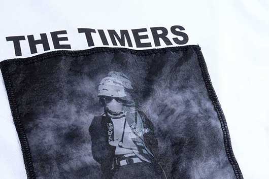 THE TIMERS 35周年を記念してTシャツが登場！ 背面には「争いの河」の