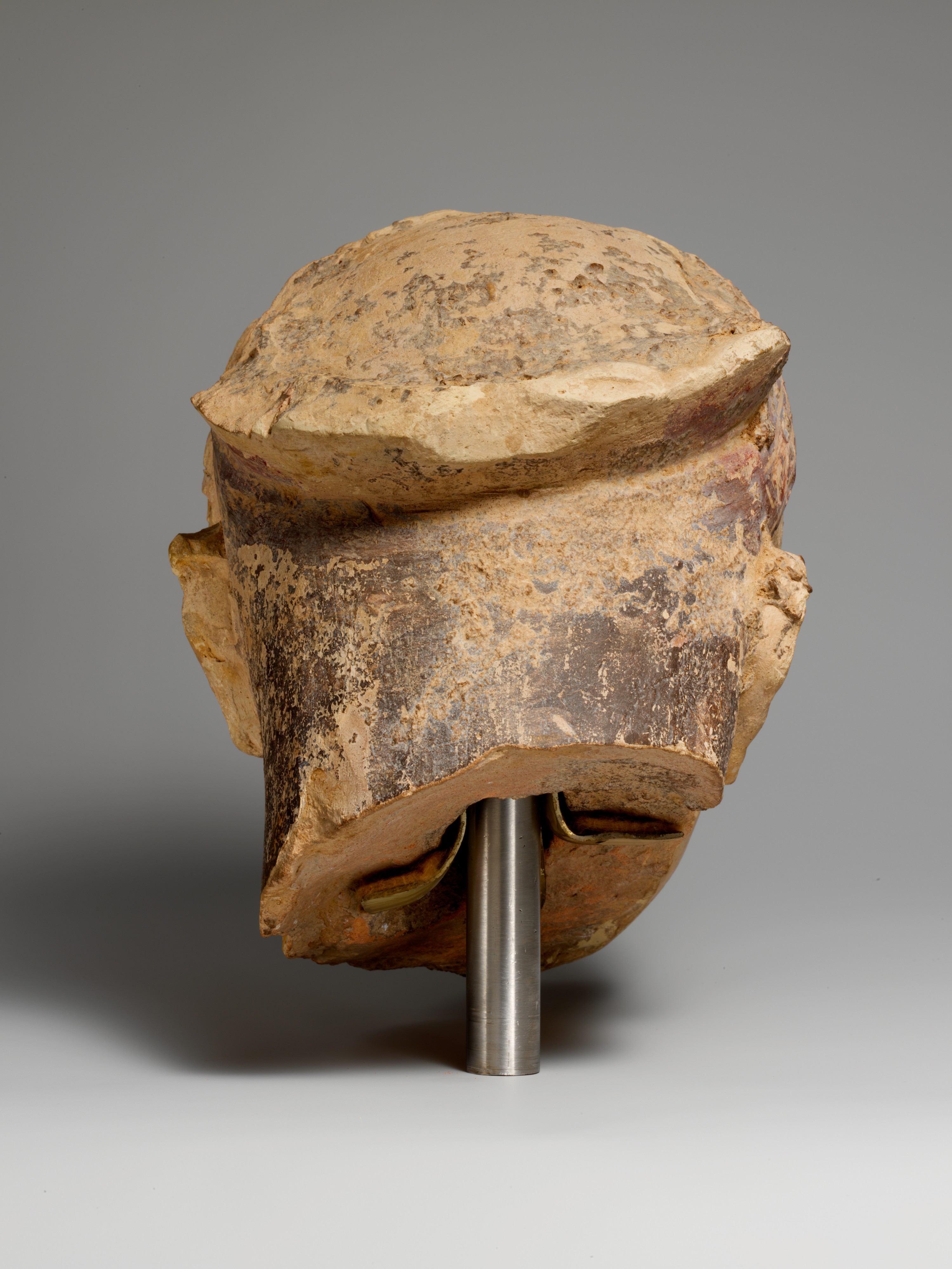 Terracotta head of a woman, probably a sphinx - Greek - Archaic